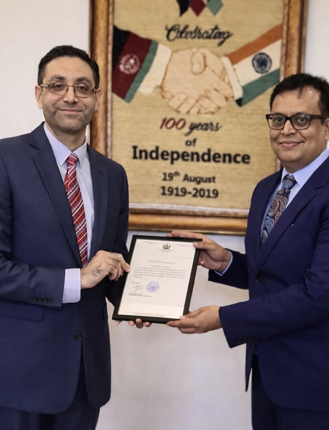 Dr. Ameet S. Dixit receiving an appreciation letter from the Embassy of Afghanistan